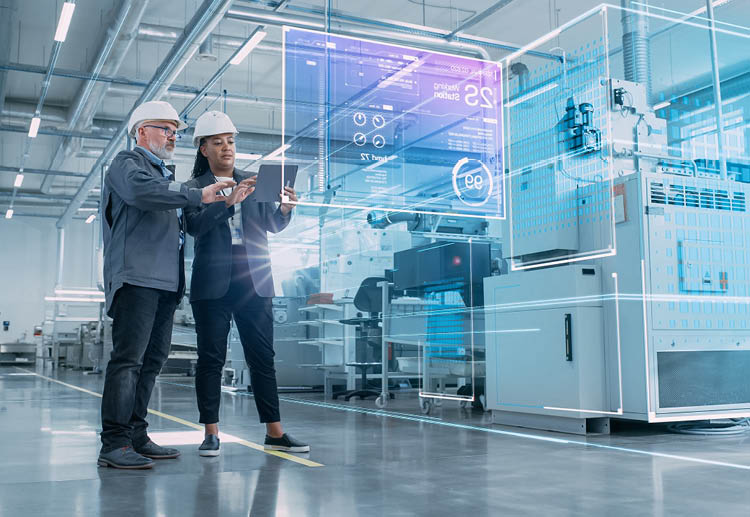 Two manufacturing professionals examine and analyze data on the job